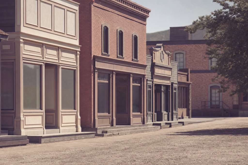 An empty backlot street of false-front American storefronts at midday, blank shopfronts. (AI-generated image)